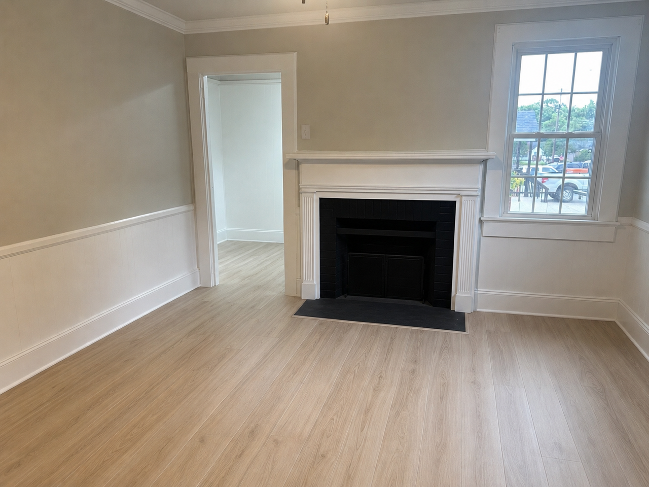 Living room with fireplace and new wood floors
