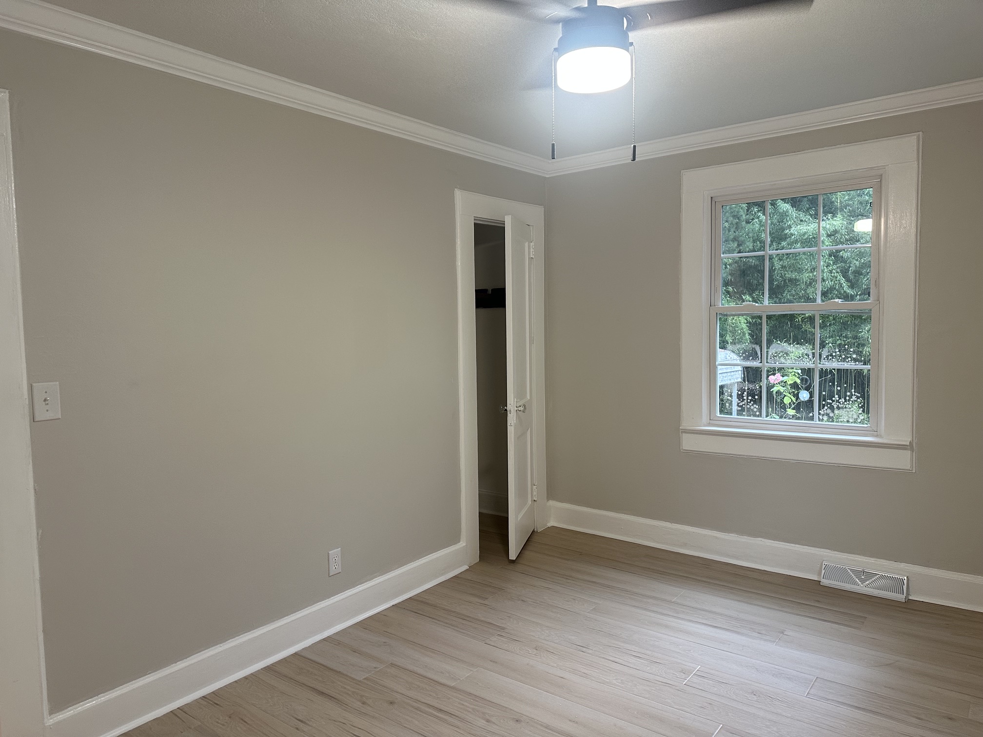 Second bedroom with closet and crown moulding