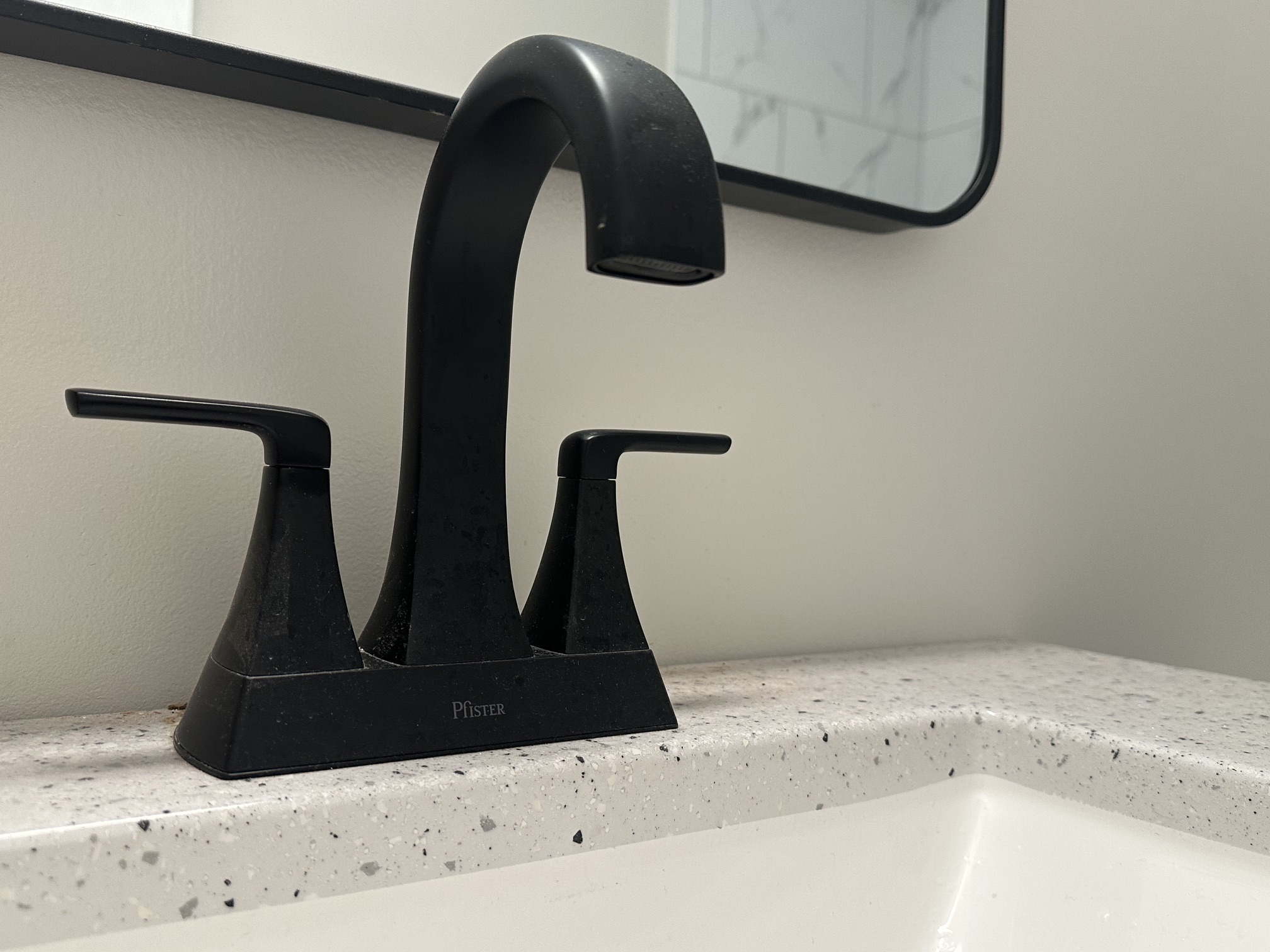 Close-up of new matte black bathroom faucet